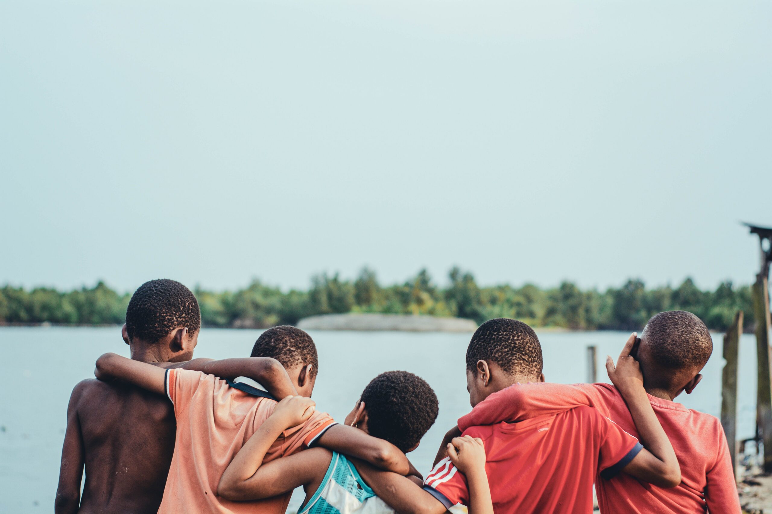 Children together at the water's edge